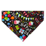 Black dog bandana with brightly colored party symbols, cupcakes, balloons, presents adorn this bandana